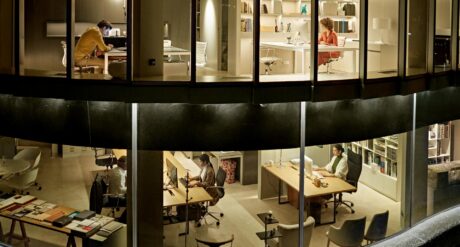 Individuals from various backgrounds managing and growing a construction business from a two-story office.